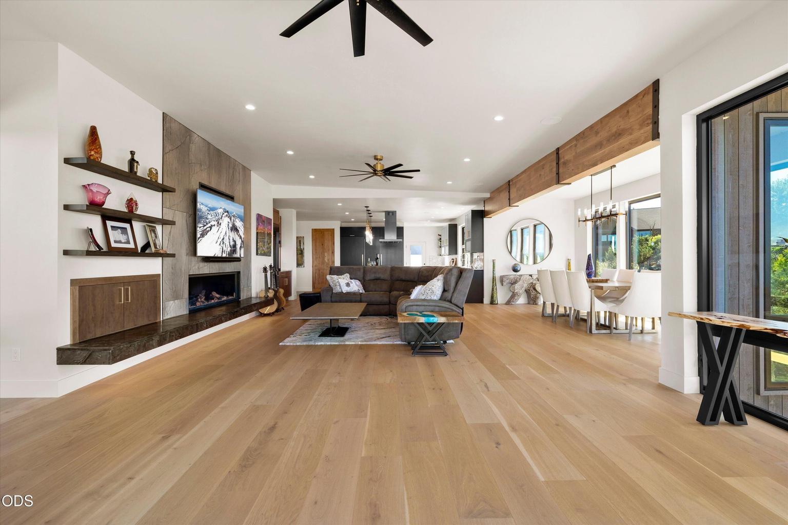 The great room is situated so that the dining room sits in its own area