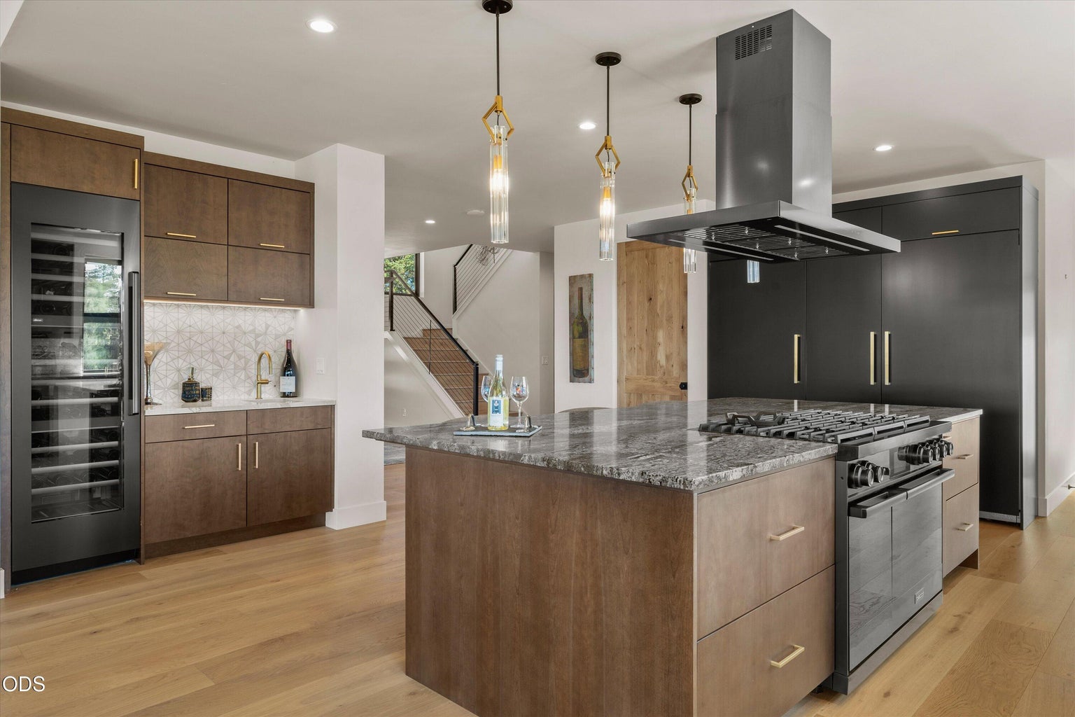 Luxury appliances, oversized island, wine fridge, wet bar - no detail is missing from this kitchen