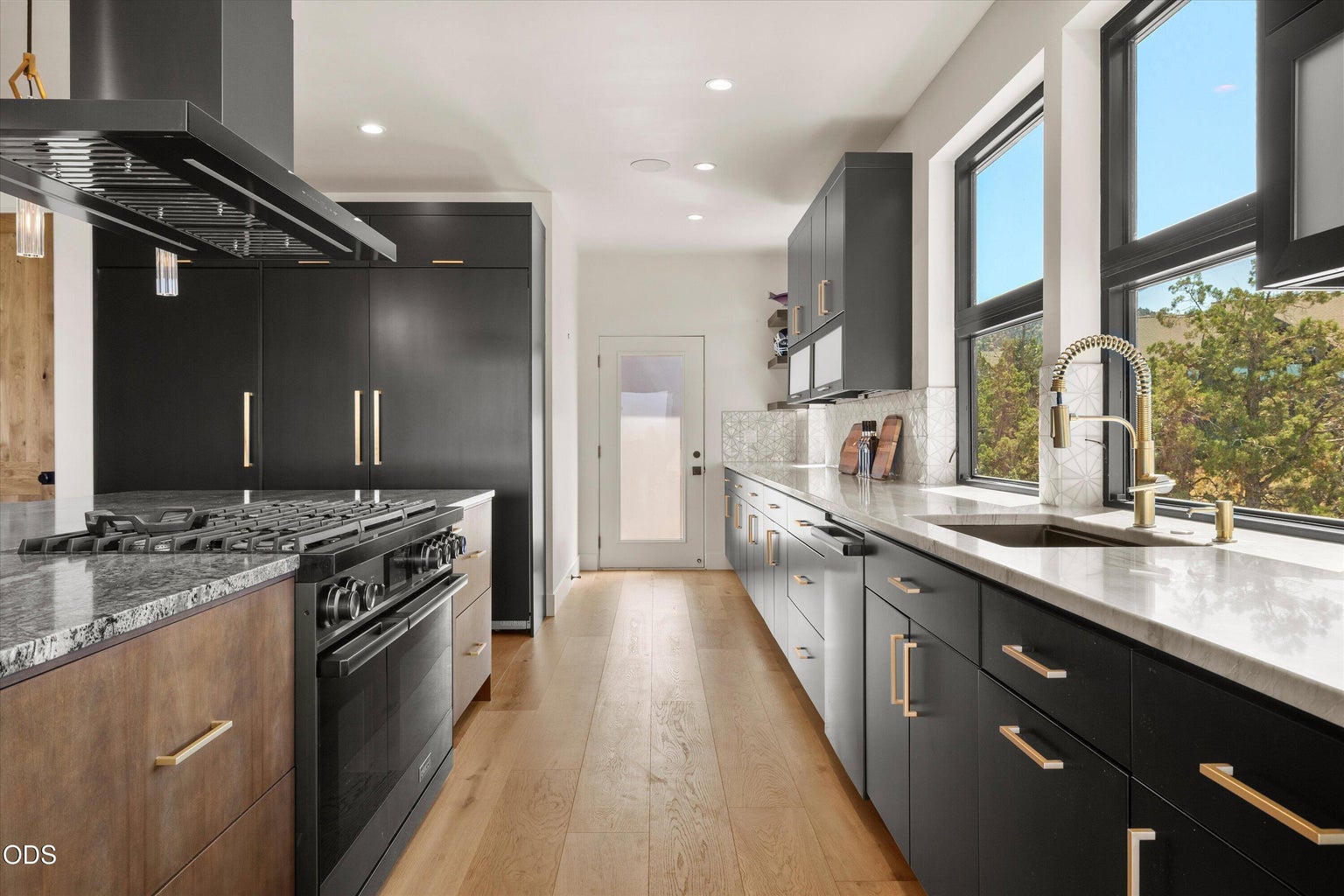 Tons of storage in this kitchen with easy access to a separate attached deck for outdoor cooking options