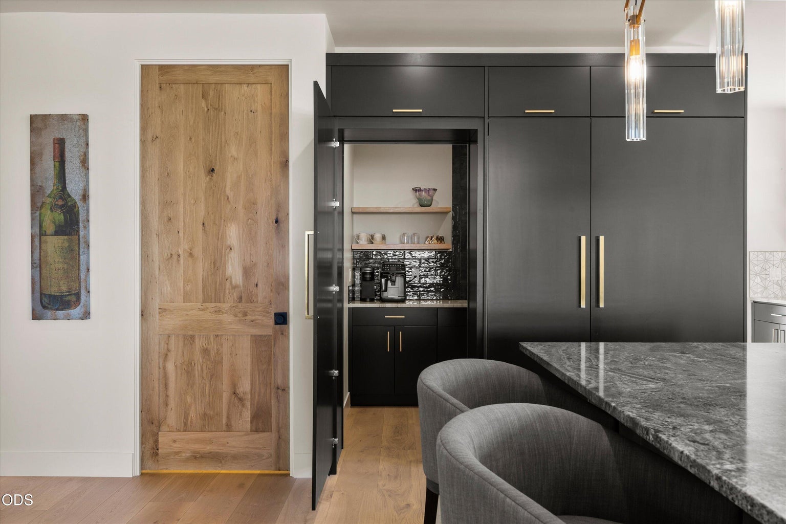 Both the refrigerator and butler's pantry are hidden paneled built-ins