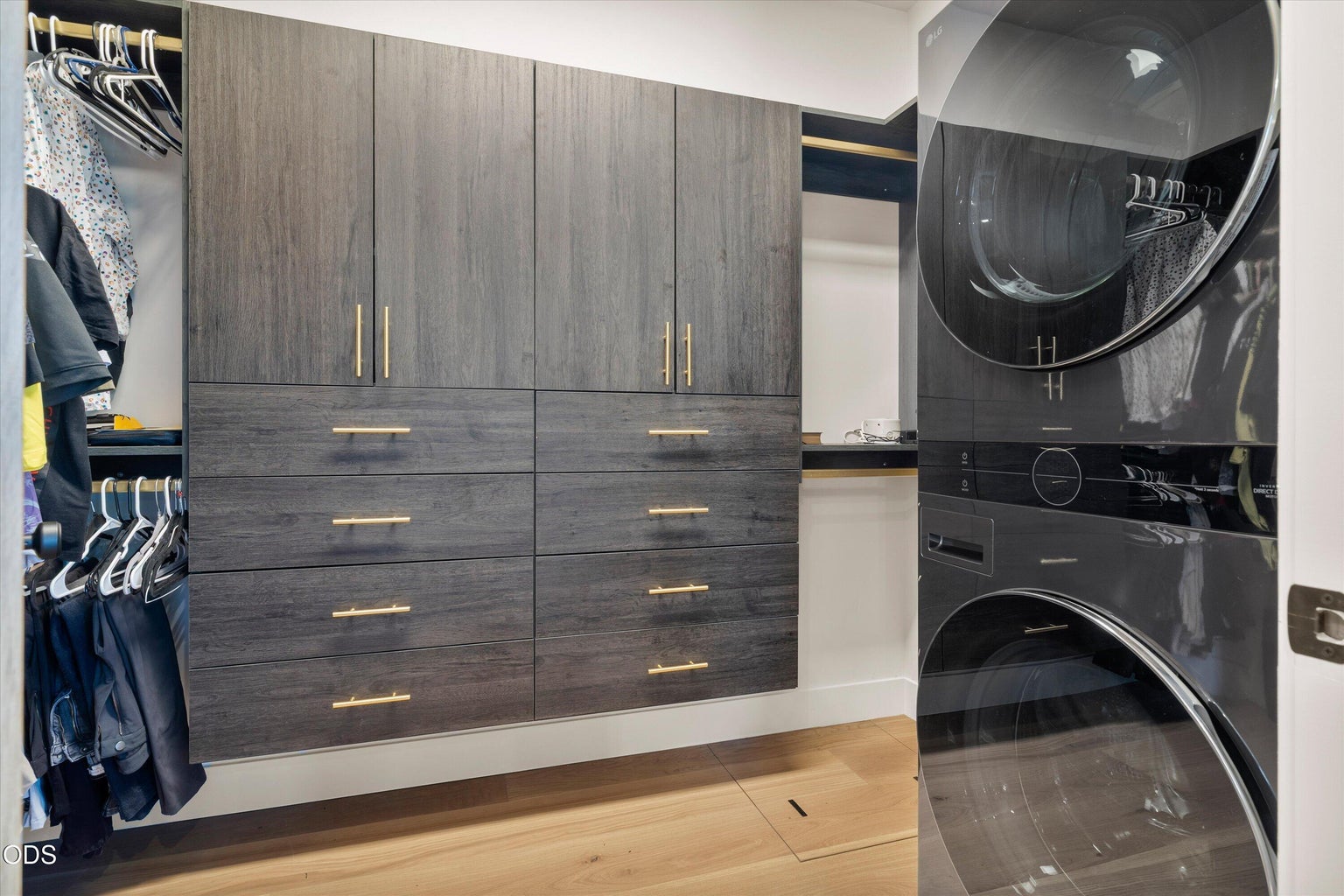 Laundry is conveniently located in the primary bedroom's walk-in closet.