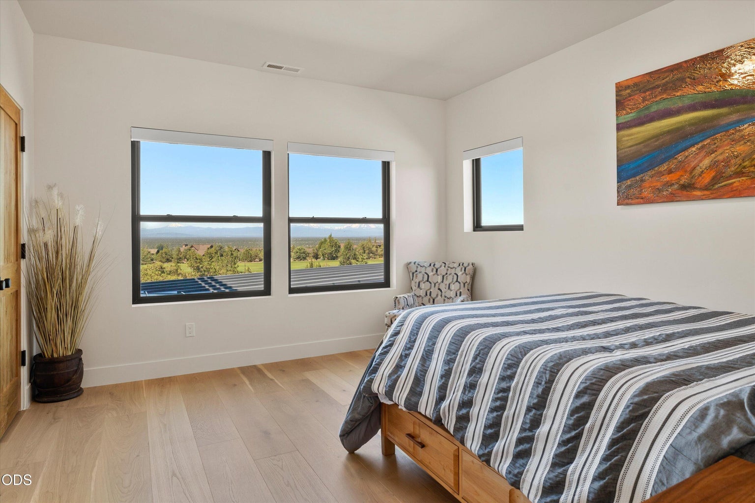 The third bedroom connected to the main home embraces the same breathtaking views