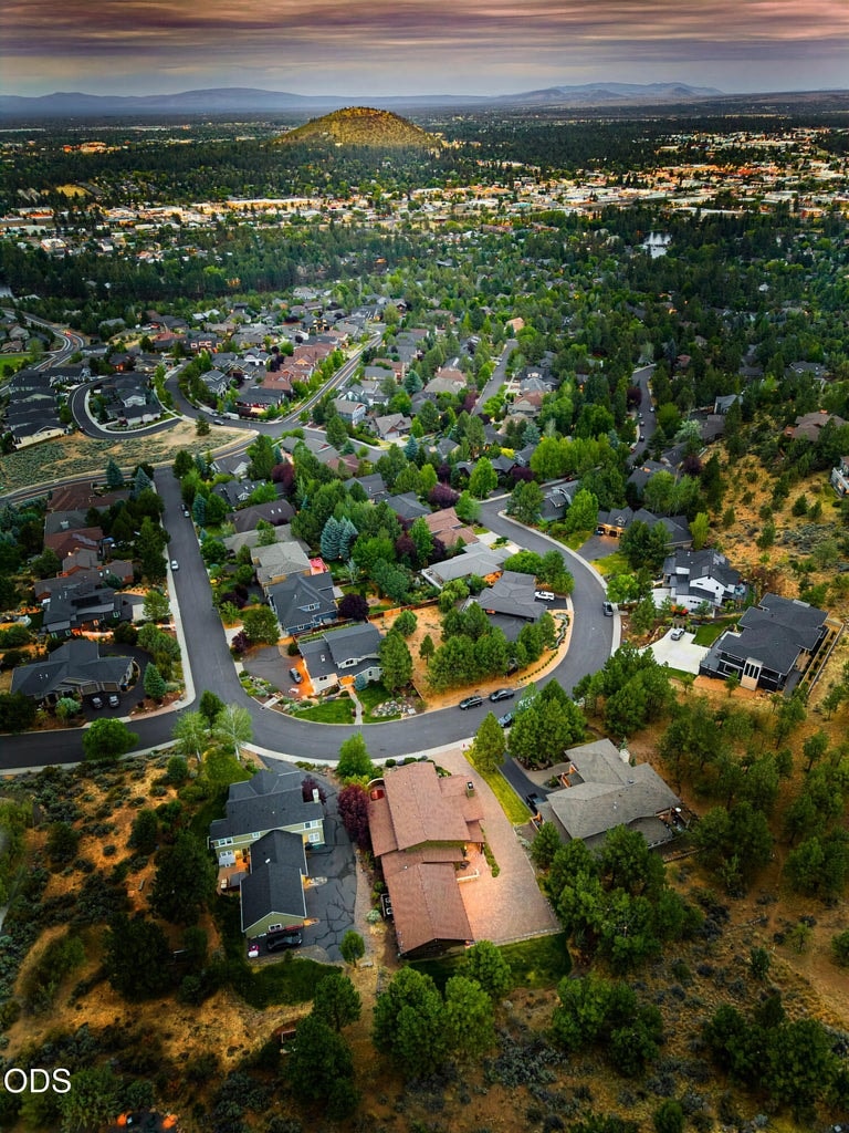 Bird's eye view of home with Pilot Butte.