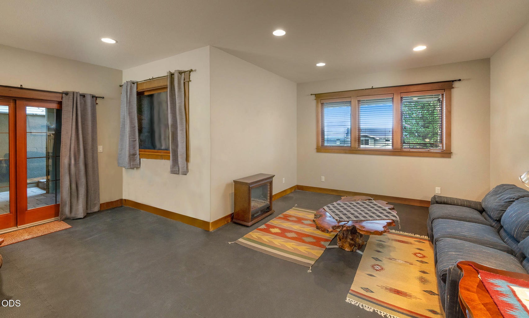 Lower level bonus room with gym tile flooring. Access to lower patio.