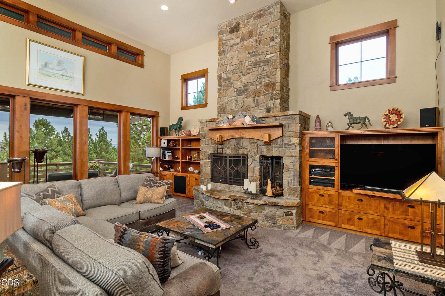 Living Room Area with Distinctive Stone Fireplace.