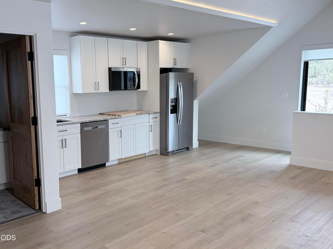 A private exterior entrance leads to the above-garage studio with kitchenette and full bathroom
