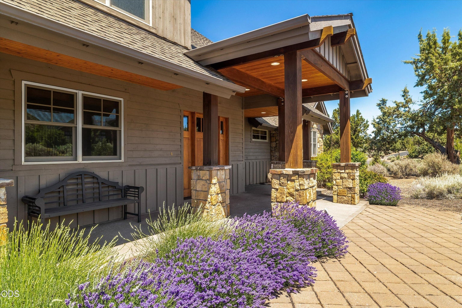 Natural and low maintenance landscaping surrounds this home on a large double lot