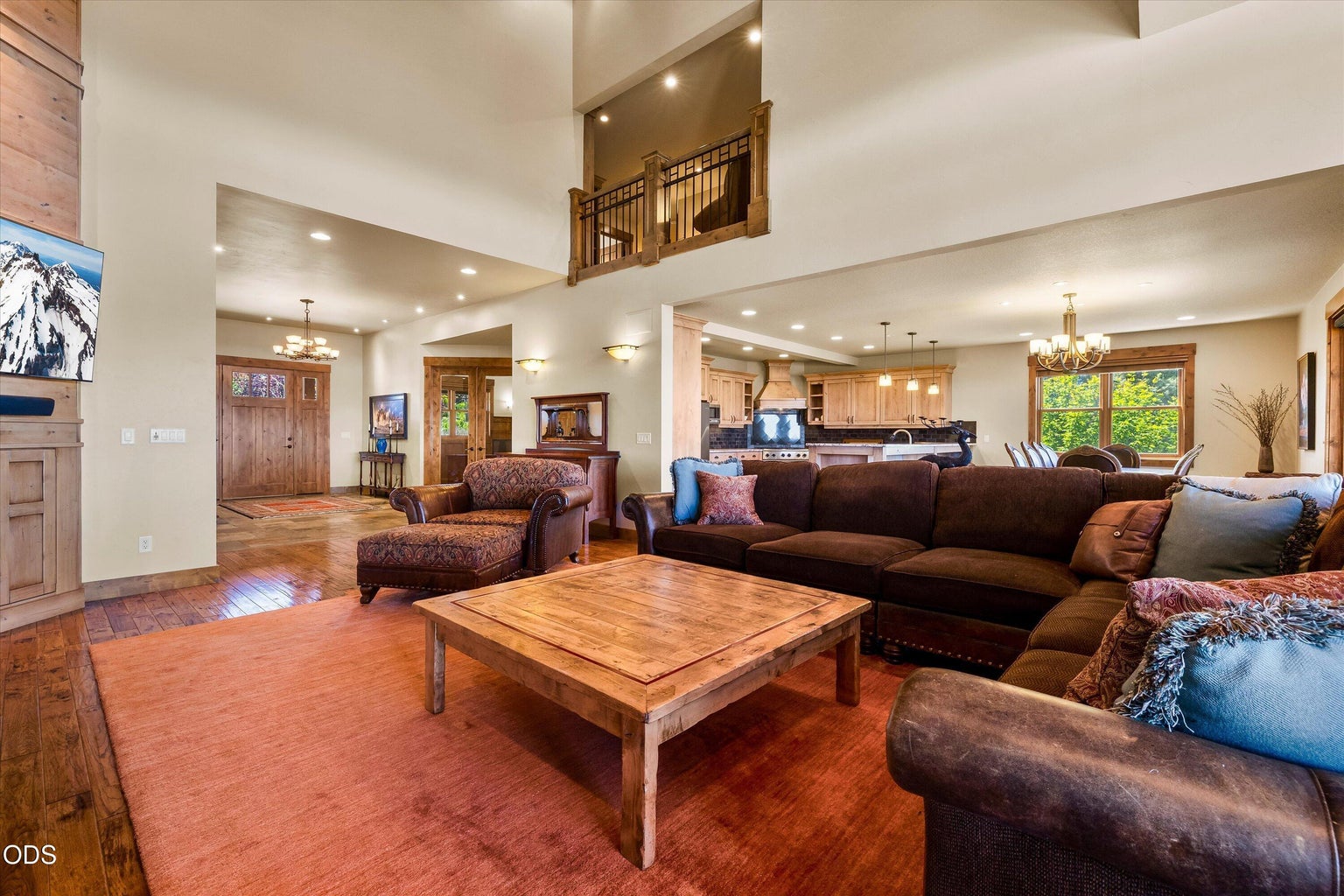 Foyer, office, kitchen, dining, great room, and loft connect this single family home