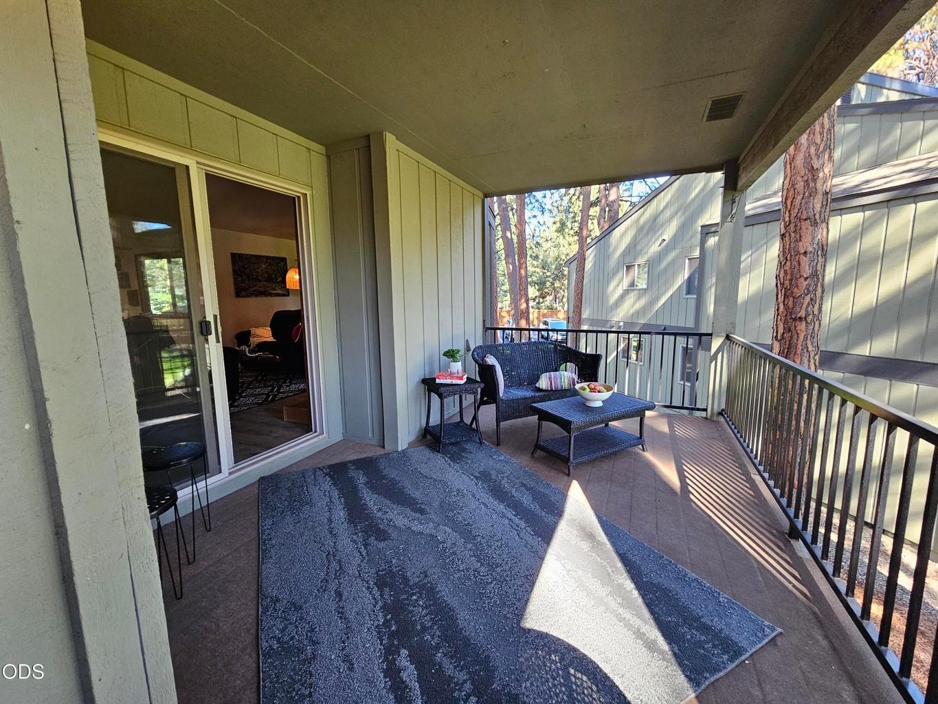 Large covered back balcony deck
