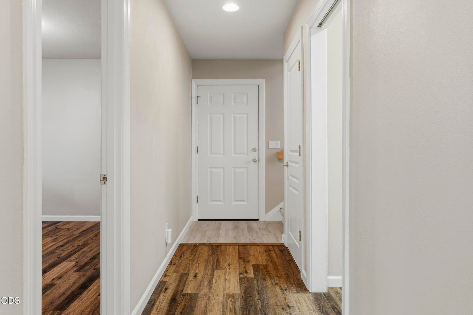 Downstairs (Laundry room on right, garage entrance straight ahead, stairs up are on the far right.