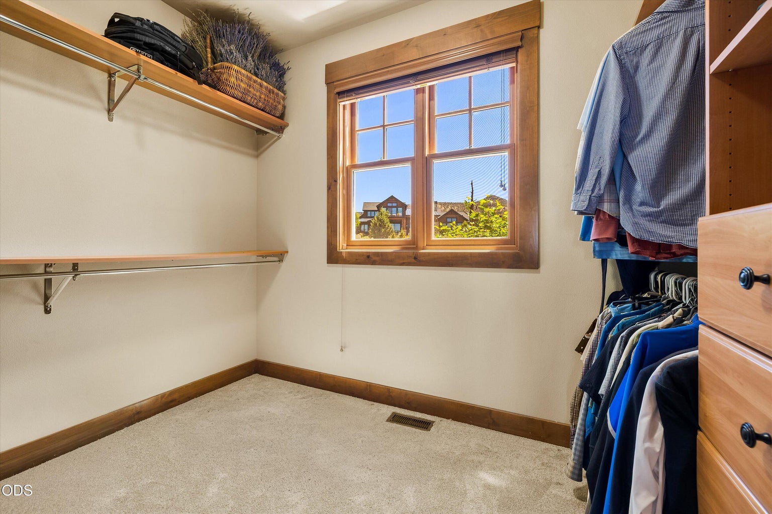 Walk-in closet with access through the primary bathroom