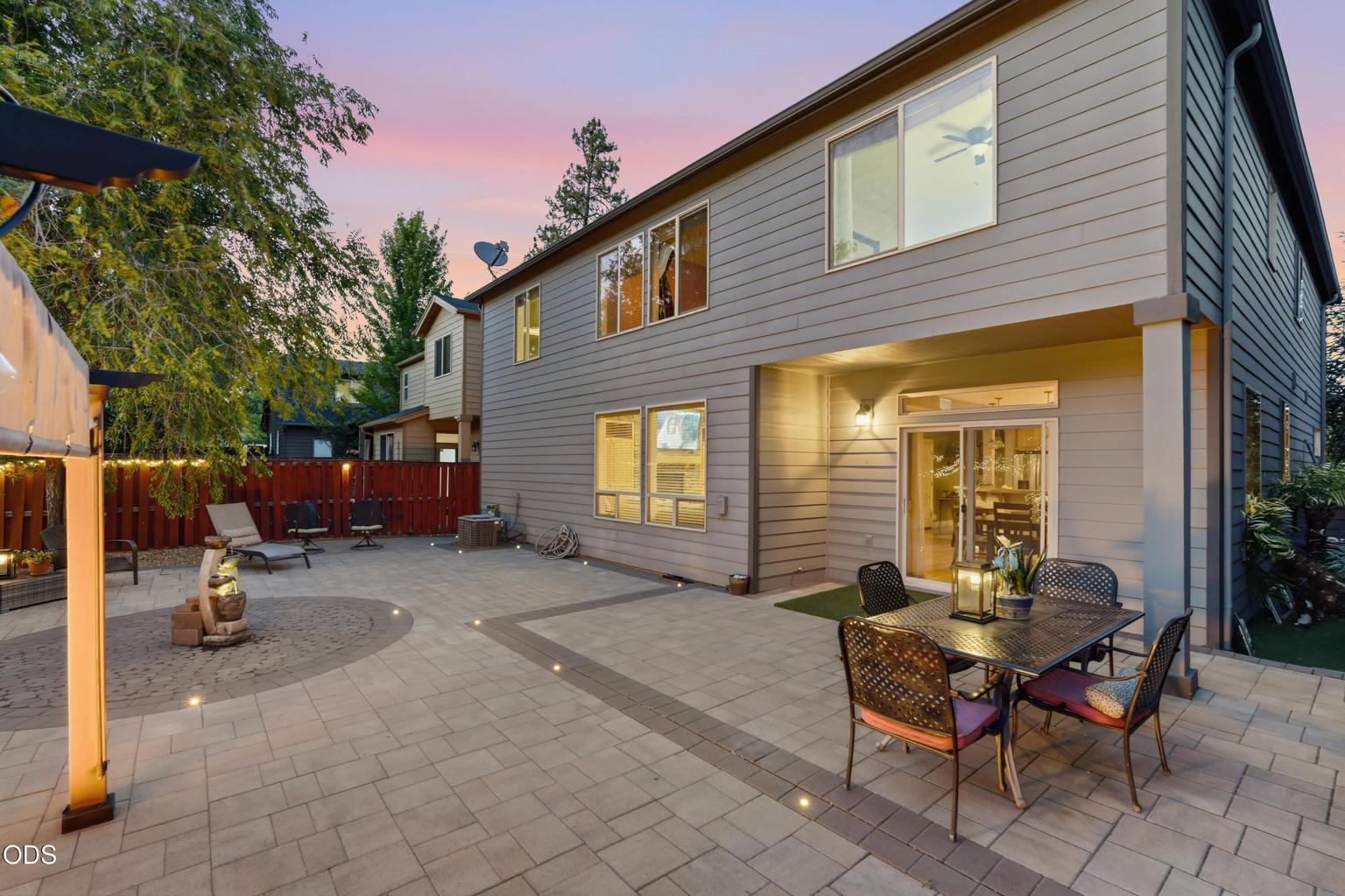 Twilight back yard built in lighting, water feature and fire pit