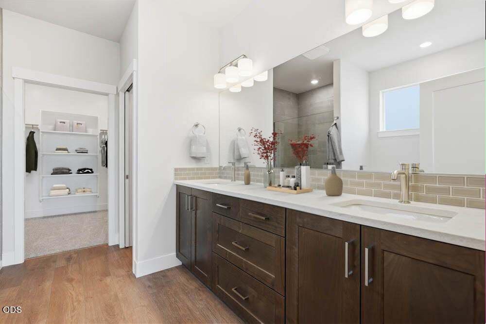Subject property main level primary bath with virtual staging