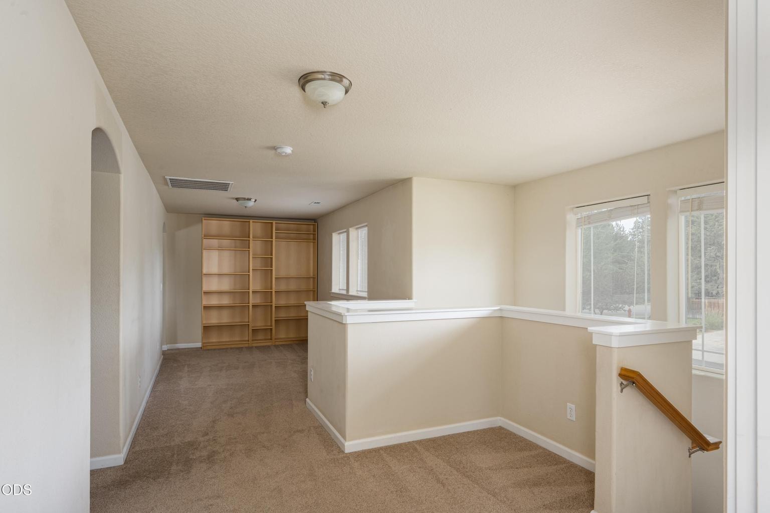Large hallway to bonus room and bedrooms