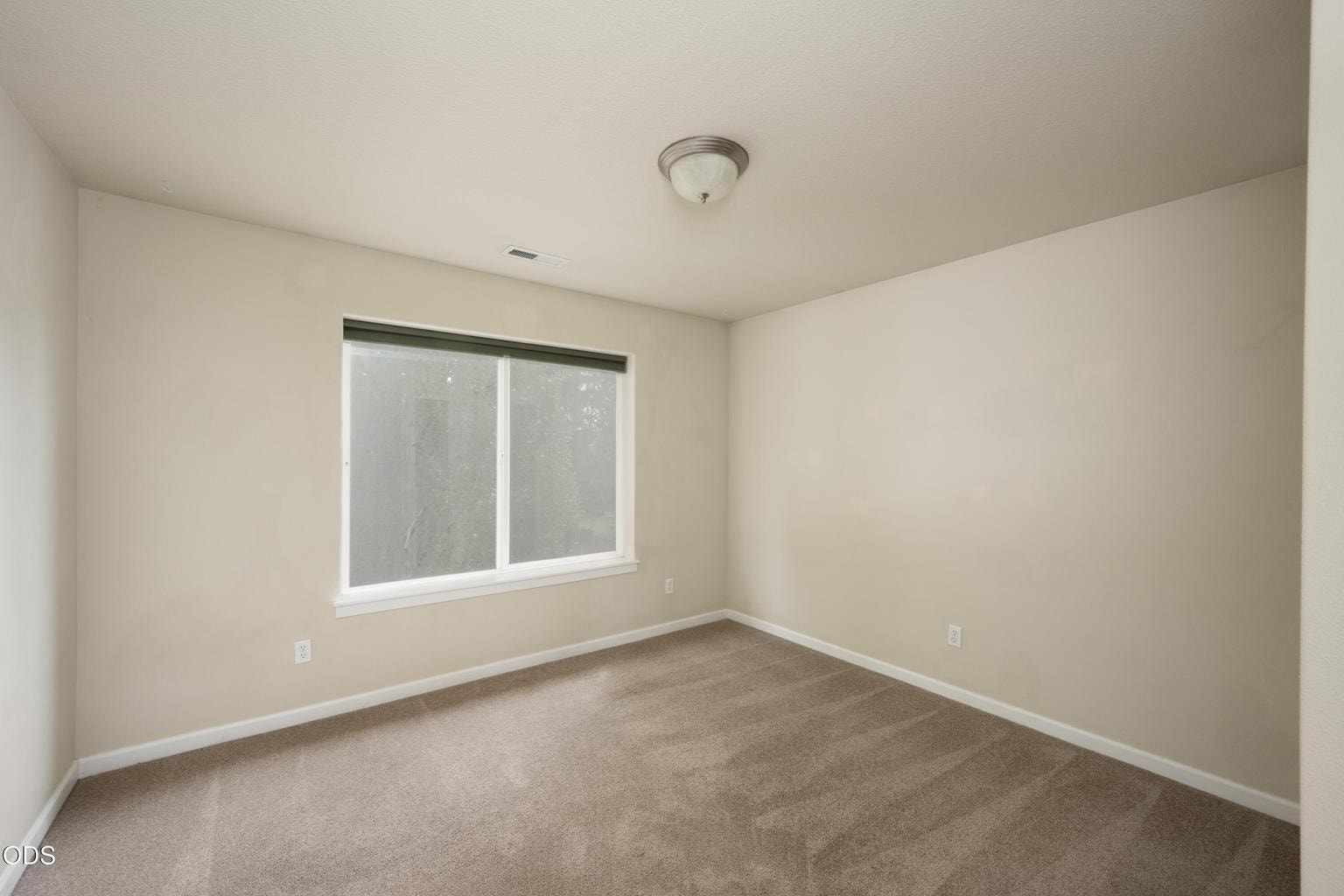 The large bedroom faces to the east and backyard
