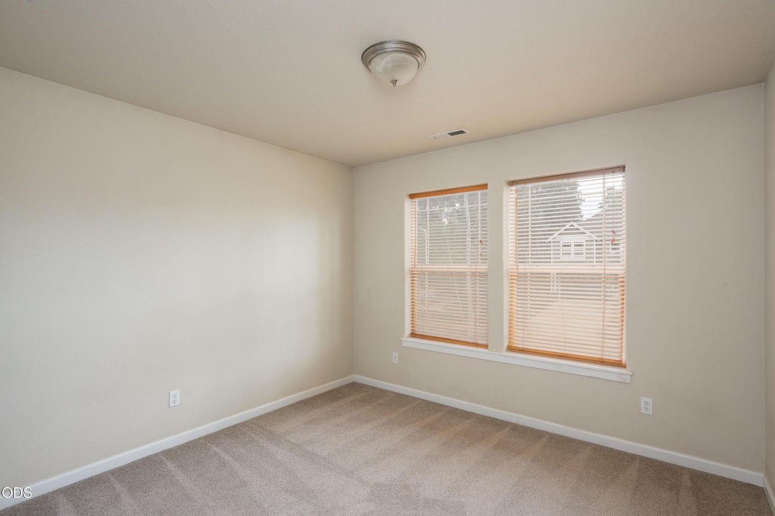 Large, spacious bedroom faces West to the front of the house