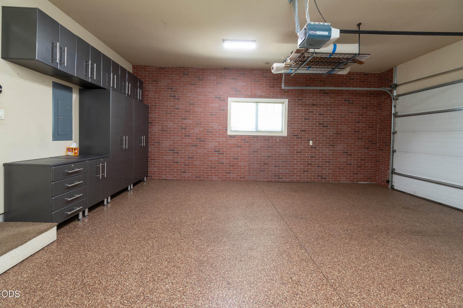 spacious 2 car garage w/cabnets and expoxy floors