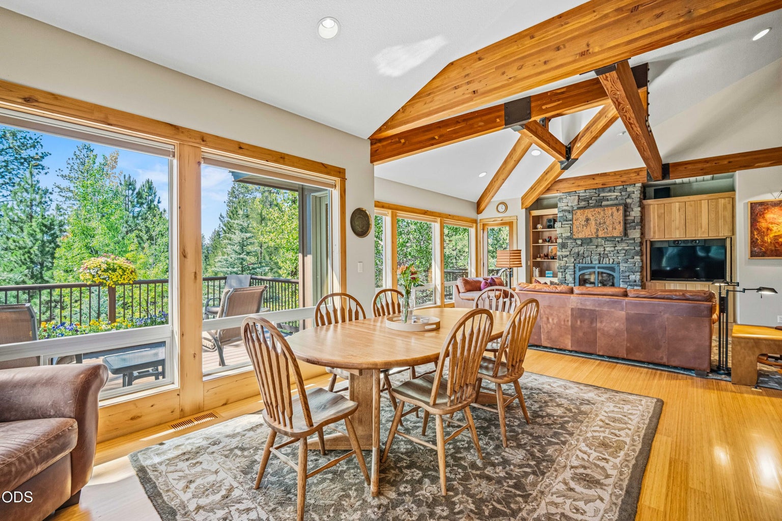 The upper deck extends living outdoors with room for dining, conversation and relaxation amid mature pines. Its orientation captures the forest setting and seasonal views toward Mt. Bachelor.