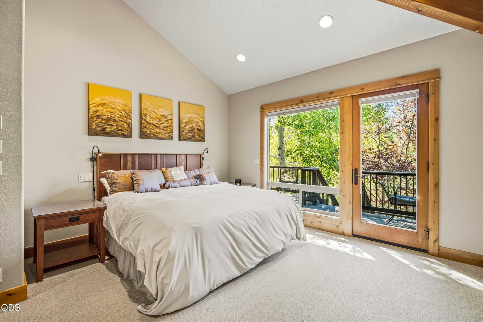The spacious primary suite opens directly to its own private deck oriented toward Mount Bachelor, creating a peaceful retreat with morning light, forest views and outdoor access.