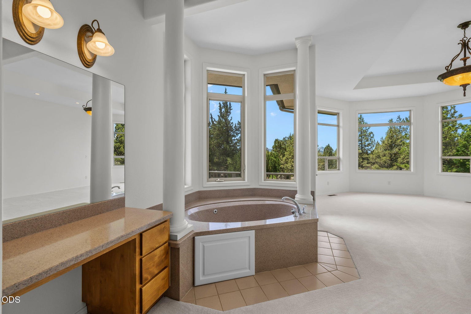 Primary bedroom soaking tub and vanity table