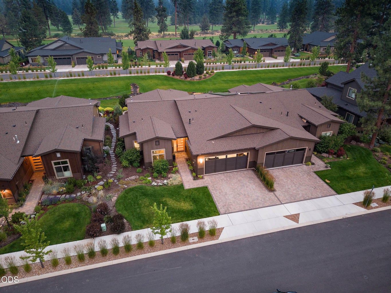 Aerial view of the home backing to green space