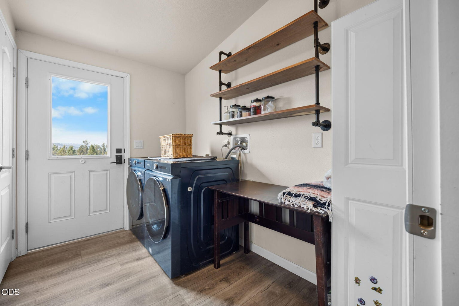 Full laundry room with storage closests, shelving and the w/d stay!