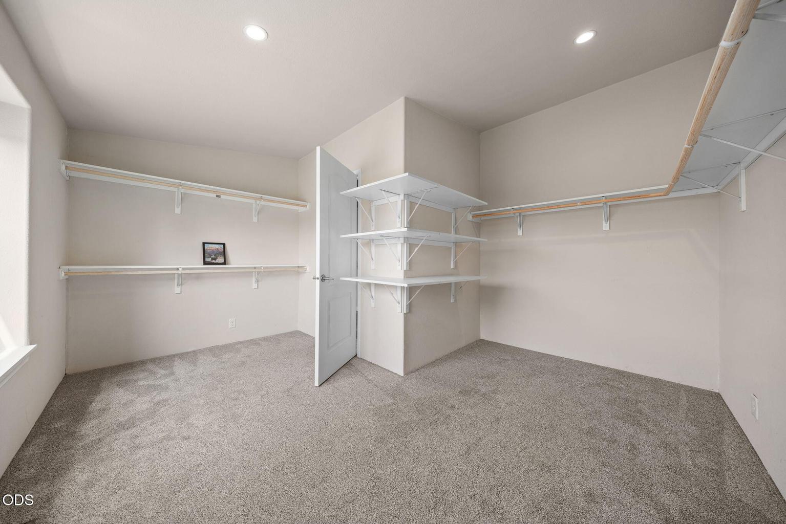 Primary walk in closet is large enough to be a nursery or office
