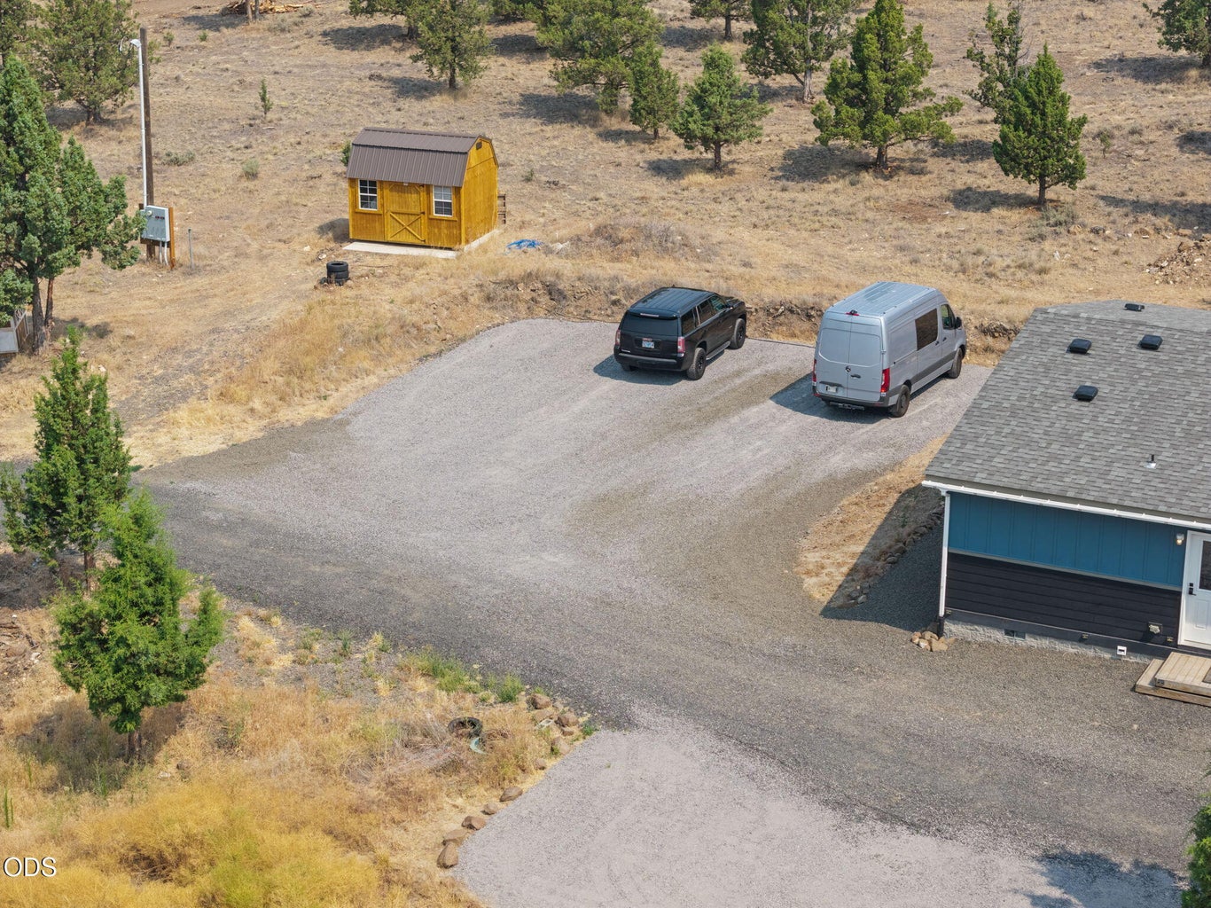 Tons of parking next to the house and a roomy shed. 200 amp seperate power pole prepped for your dream shop!