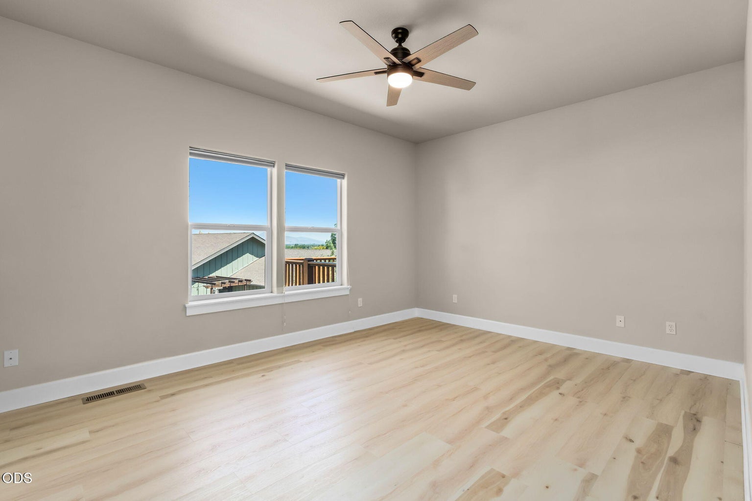 Primary suite w/ views, ceiling fan, new wood look flooring.