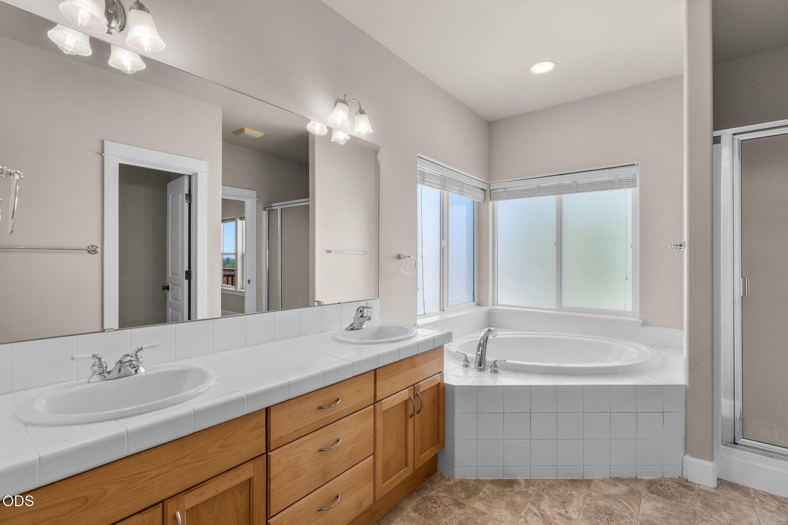 Soaking tub, dual vanity, step in shower.