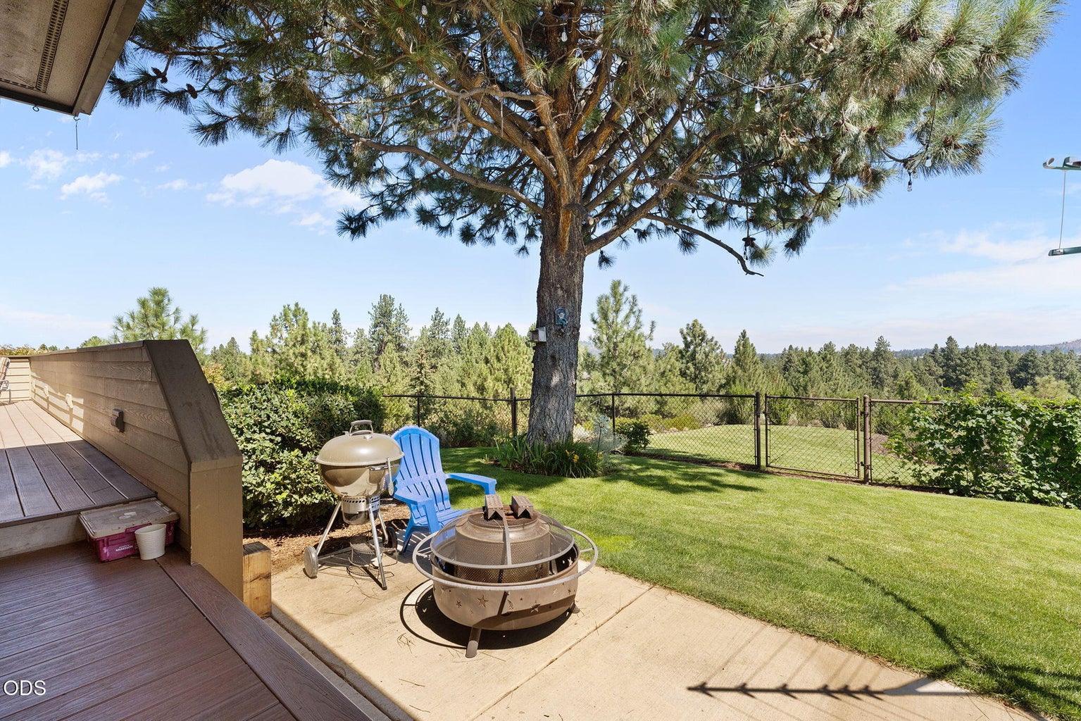 Fenced backyard with composite deck with panoramic views