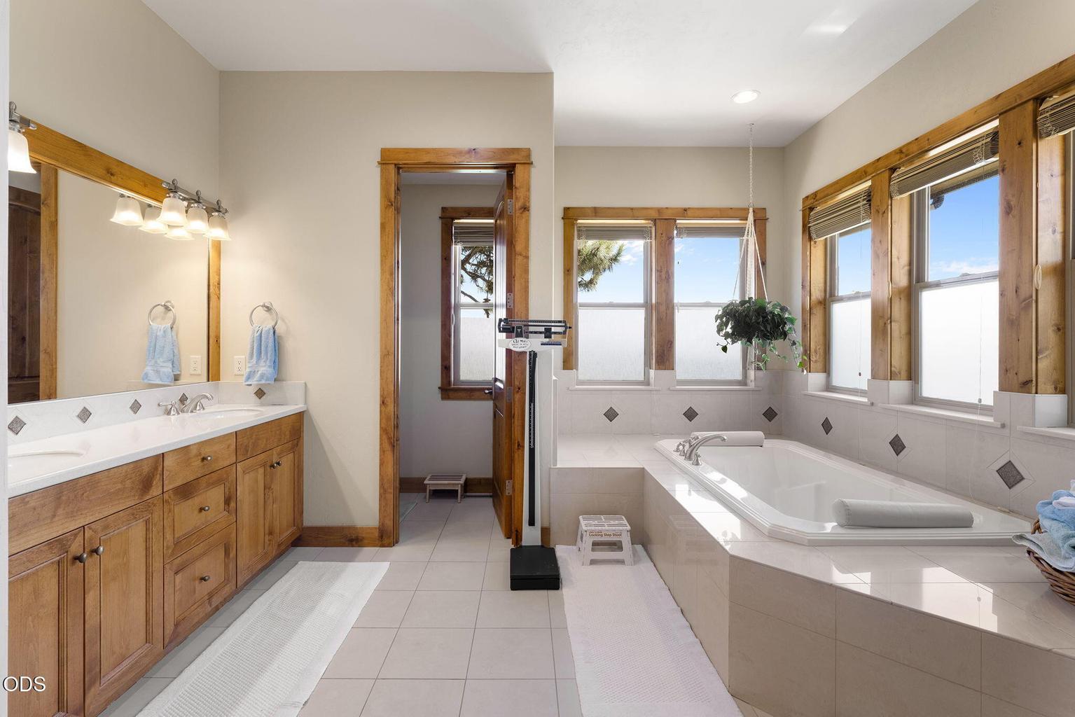 Primary Bathroom with Dual Vanities and Soaking Tub