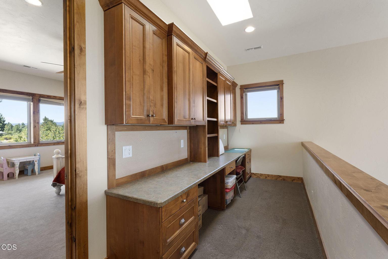 Workspace at top of stairs landing/loft