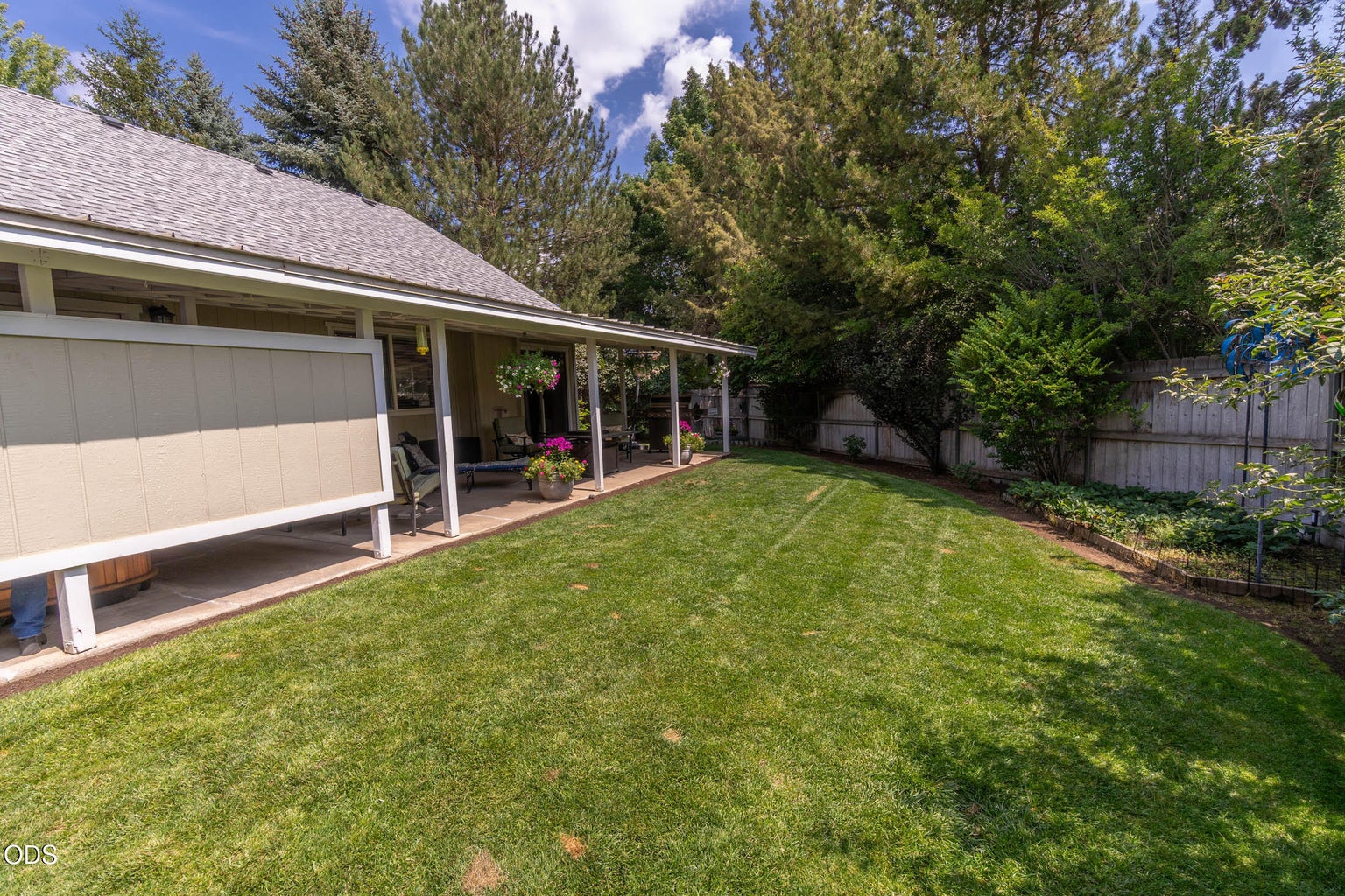 The back yard is fenced-gated-sprinkled for convenience and ease of care. You will find lovely bushes, trees, plantings, and plenty of quiet privacy for your year-round enjoyment.