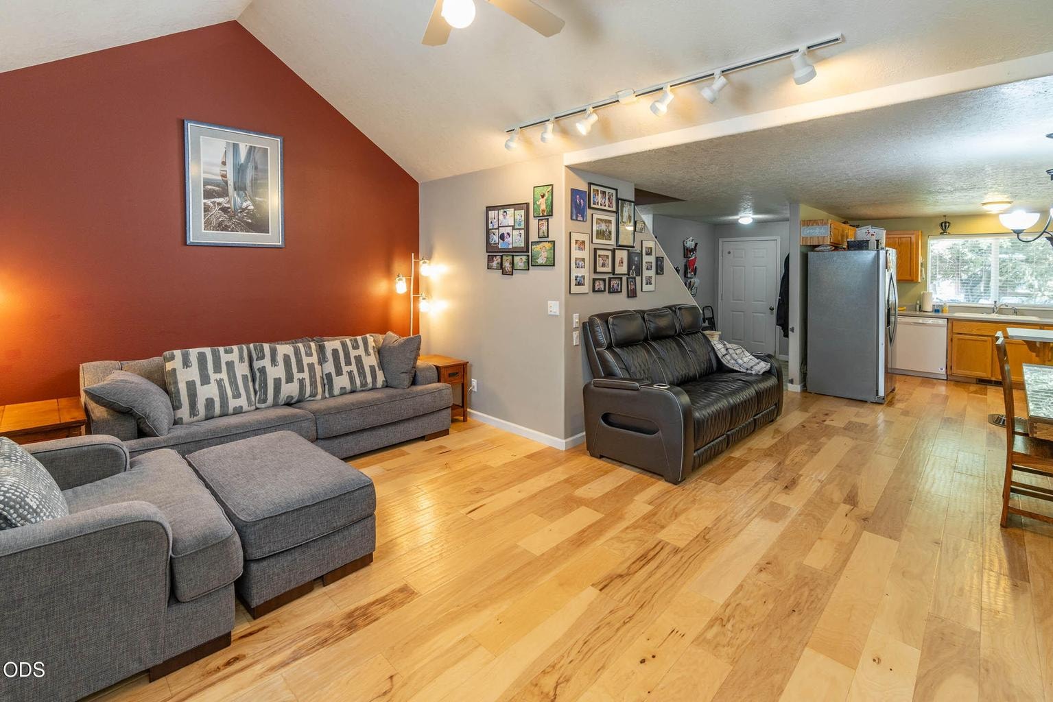 Spacious layout with ample entry, primary bedroom suite, power room, and laundry also on the main level.