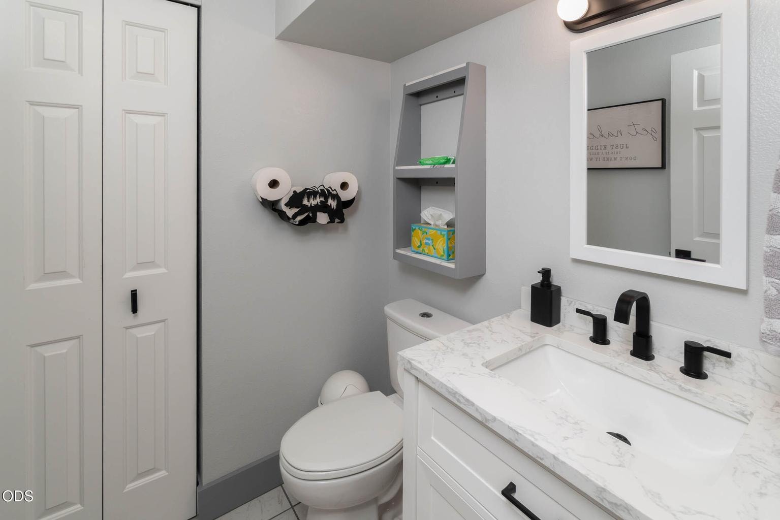 Powder room and all baths are updated with lovely quality craftsmanship with a timeless design. The marble quartz and tile are stunning with the white cabinetry. You will really appreciate the closet in this powder room.