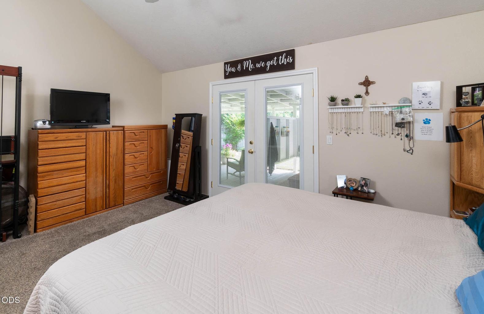 Main-level primary with ensuite and spacious walk-in closet. This vaulted room also features lovely French doors to the convenient spa area!