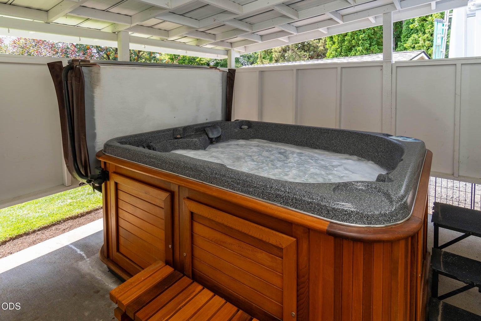 The newer Artic Spa is enclosed and convenient to the primary bedroom and patio area.