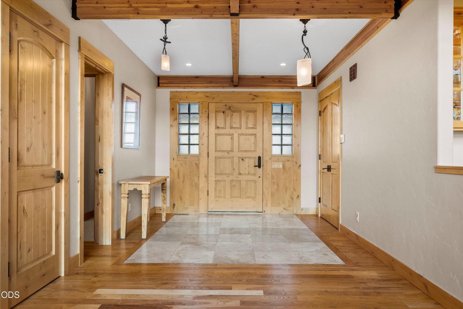 Back off the grand foyer is the second primary bedroom