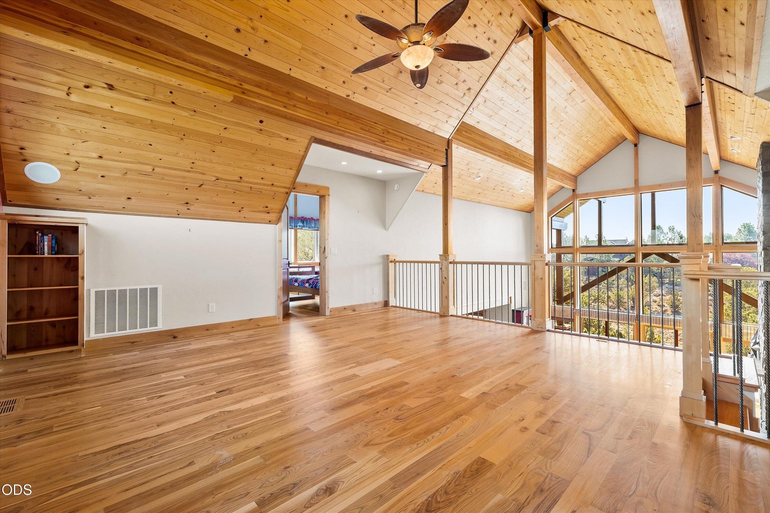 Oversized loft for an office, media room, den, gym, second family room - sky is the limit (as framed by the great room windows extending into the vaulted ceilings)