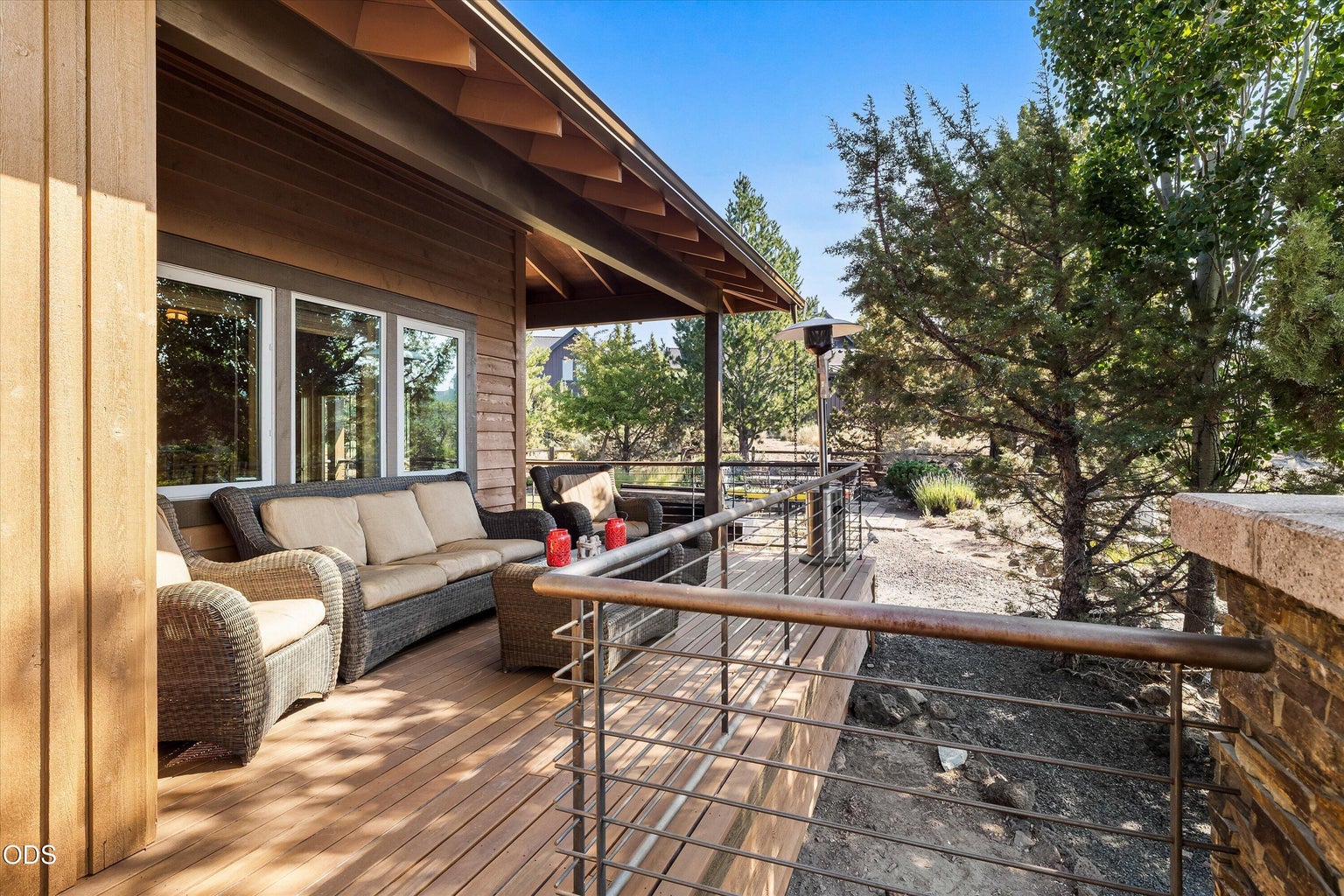 The back deck off the dining room connecting the side yard to the Great Room and Primary Bedroom decks