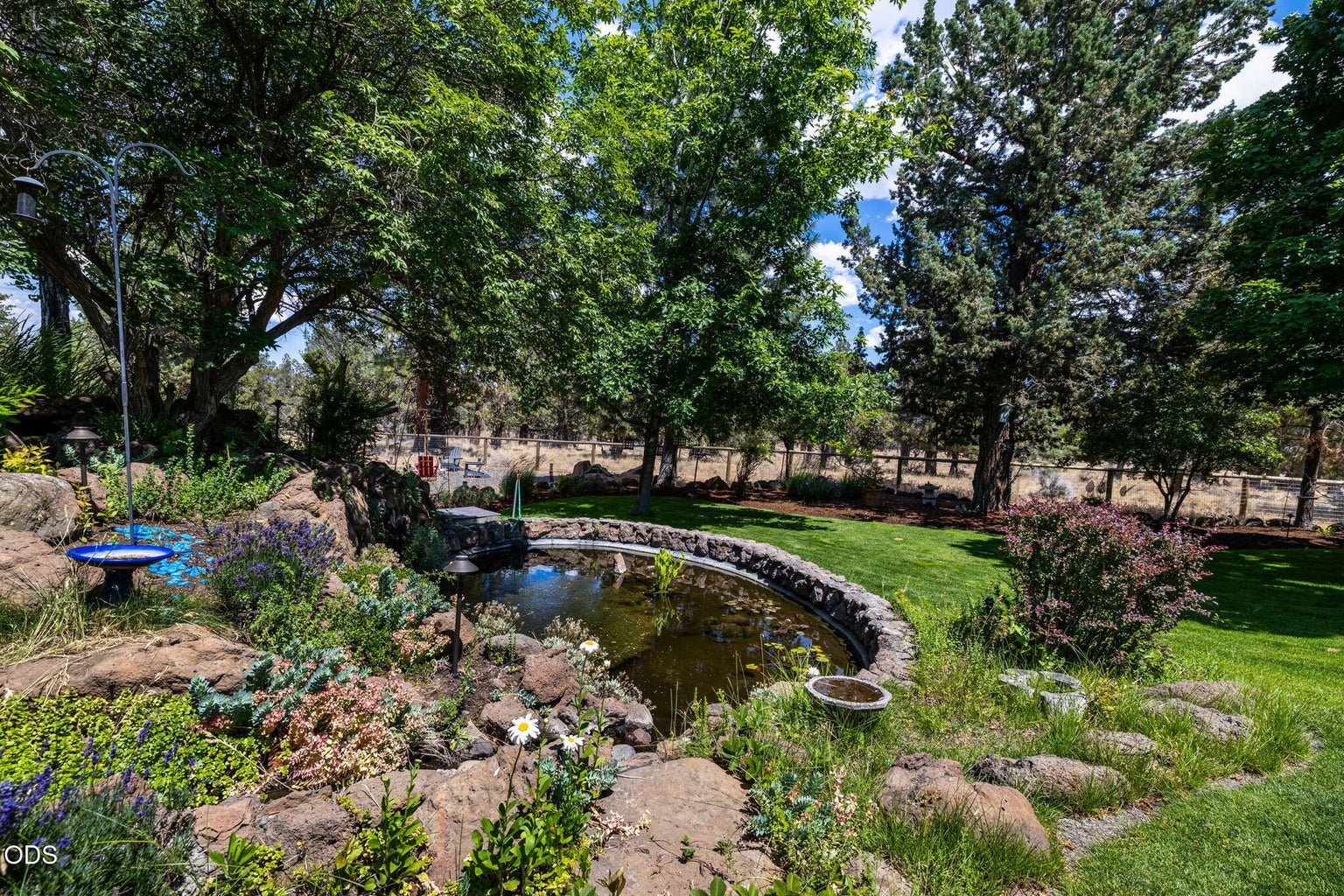Enjoy the serenity of the water feature and pond
