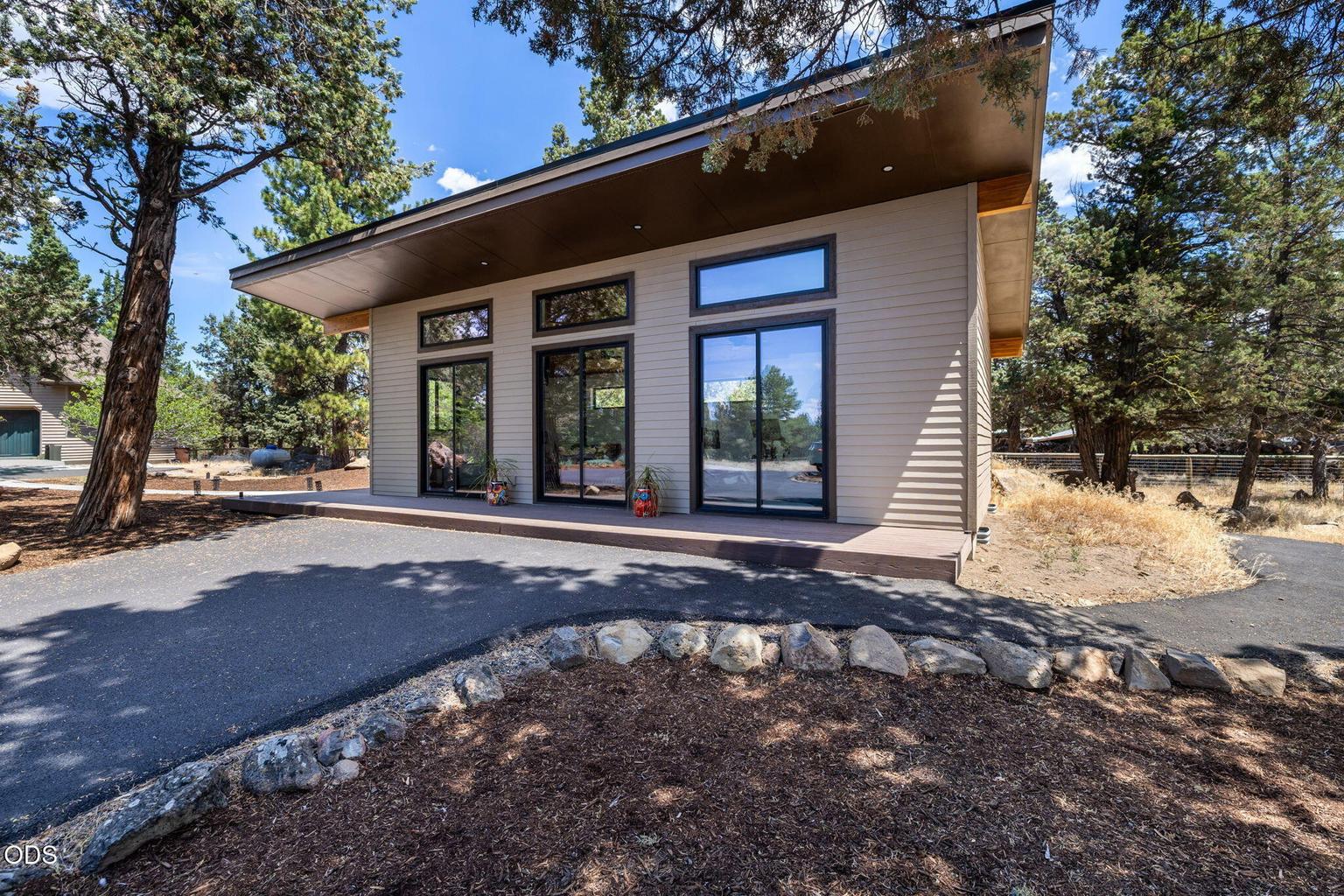 Detached office/exercise studio features mountain views and private sauna