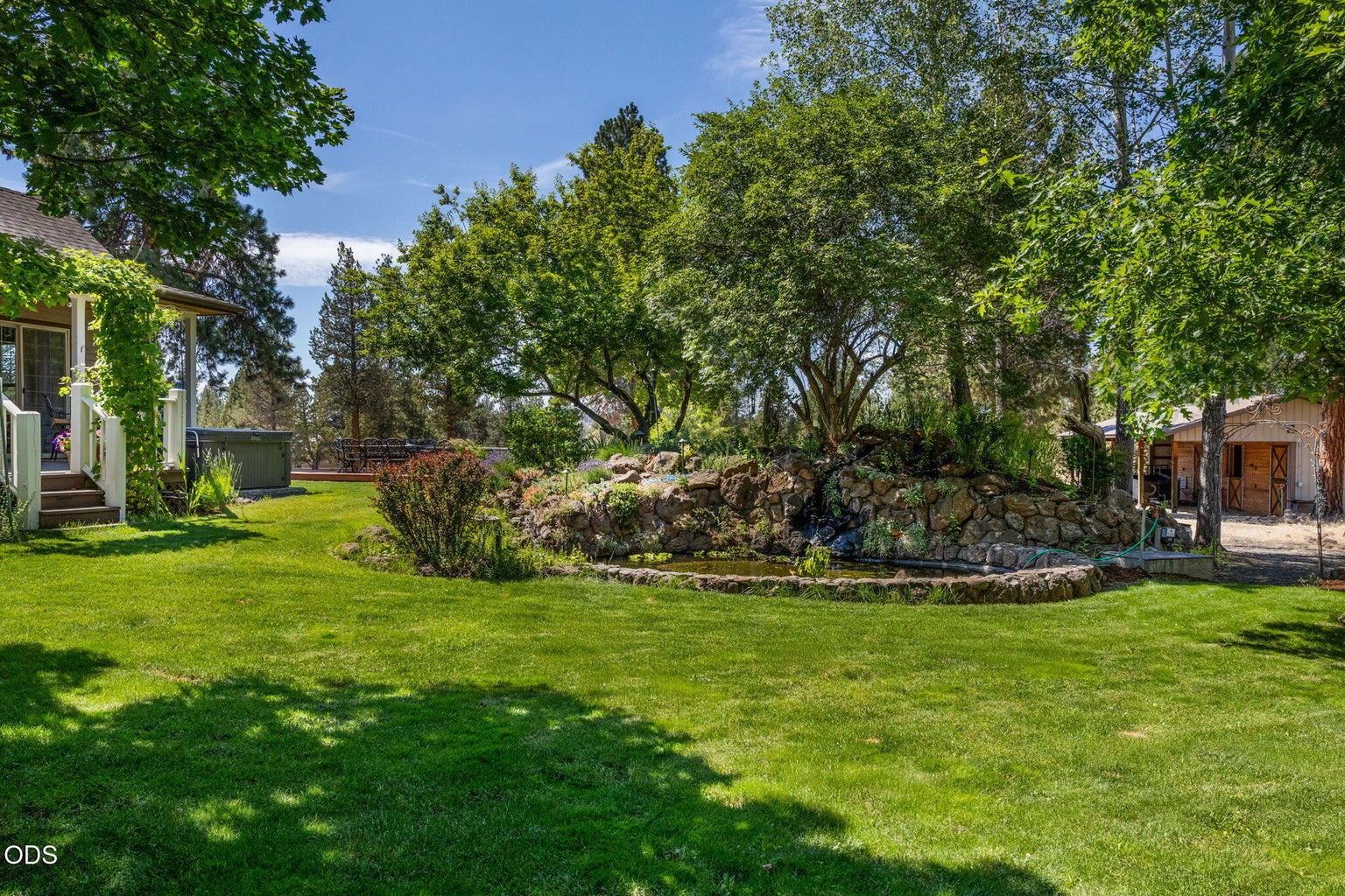 Beautiful landscaped yard with pond and water fall