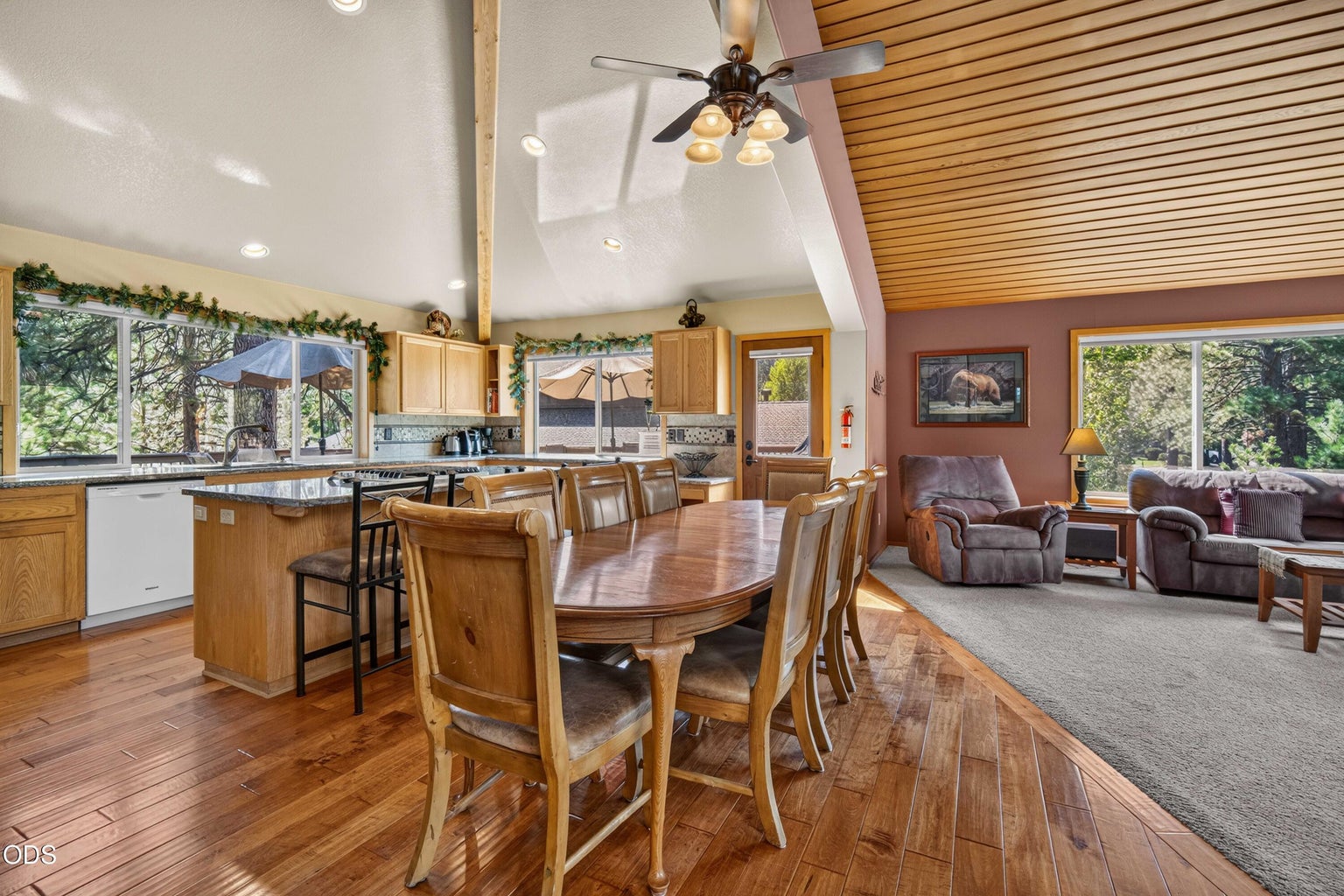 Vaulted ceilings, warm wood details and an open gathering space create an inviting centerpiece for time together in Sunriver.
