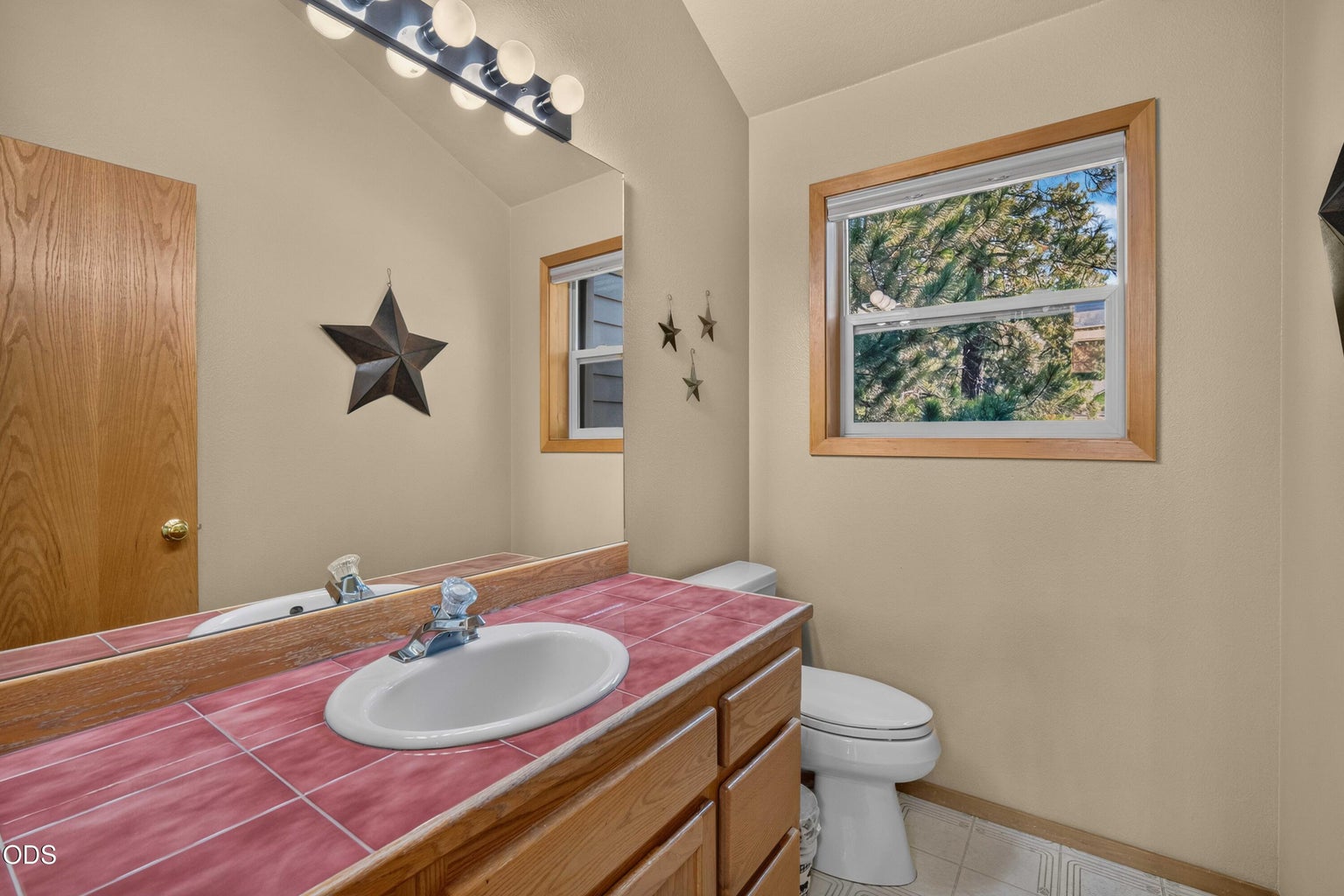 Convenient upstairs half bath located just off the main living areas and near the primary suite.