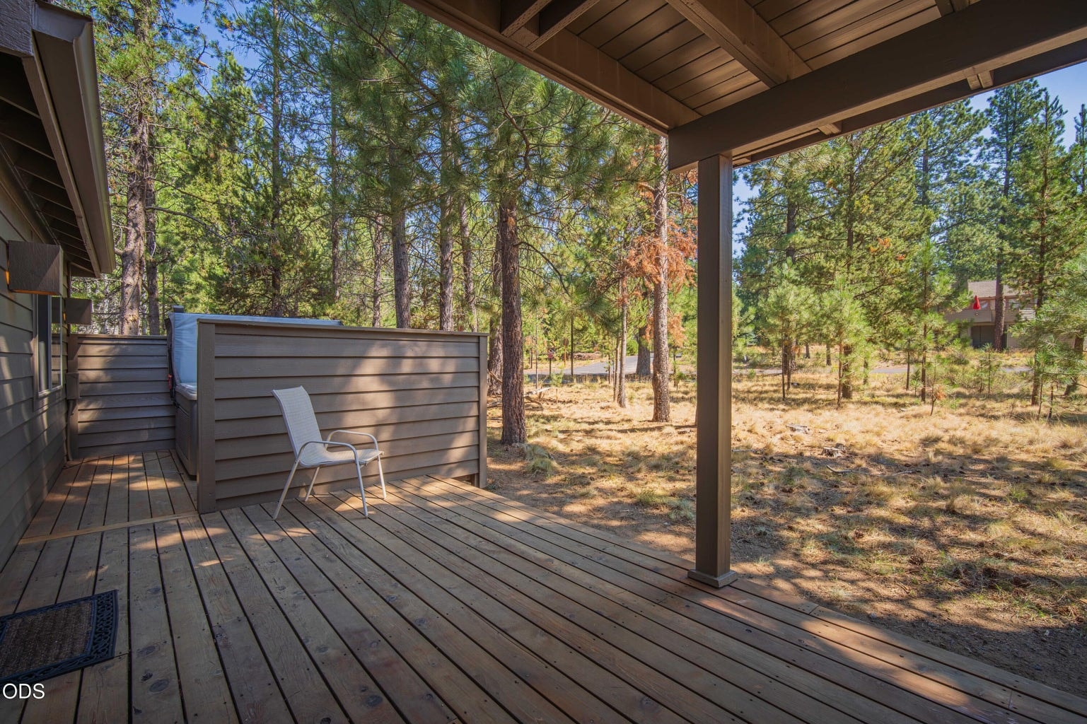 The lower deck provides additional outdoor living space with access from both the downstairs suite bath and the downstairs guest bath, plus an easy connection to the hot tub.