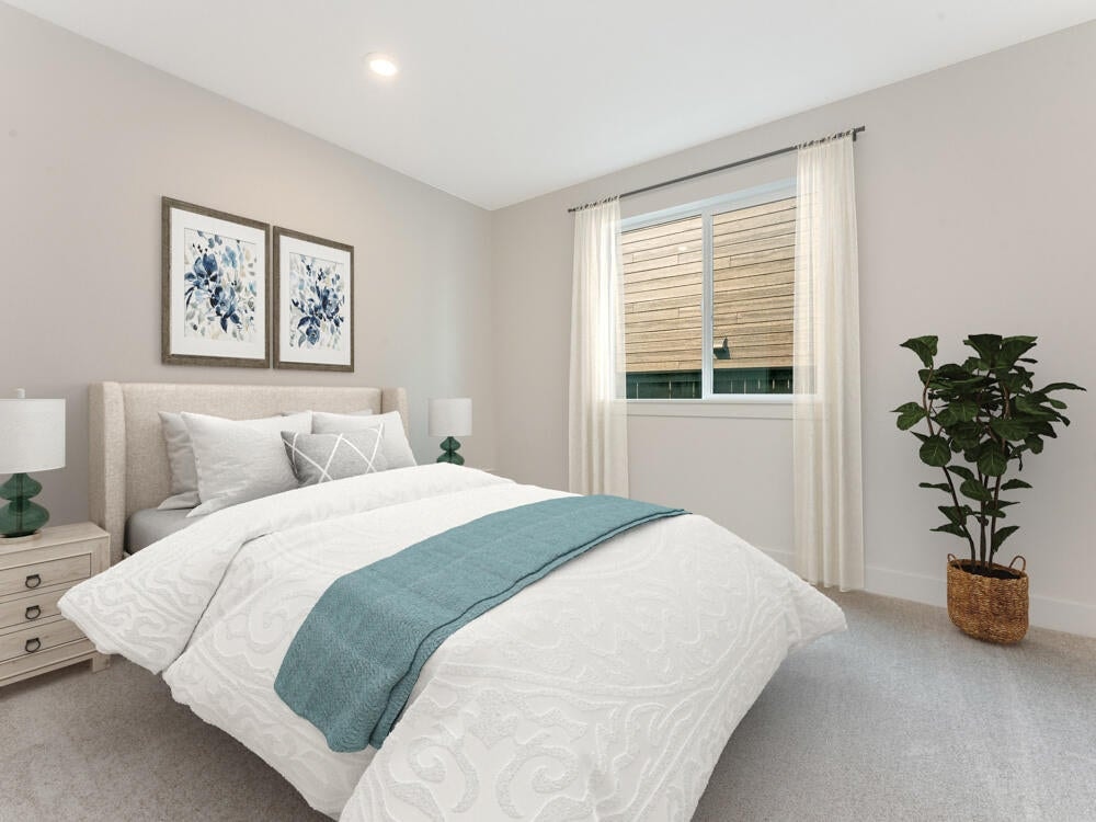 Image of downstairs bedroom has been virtual stage. Colors and surfaces may vary.