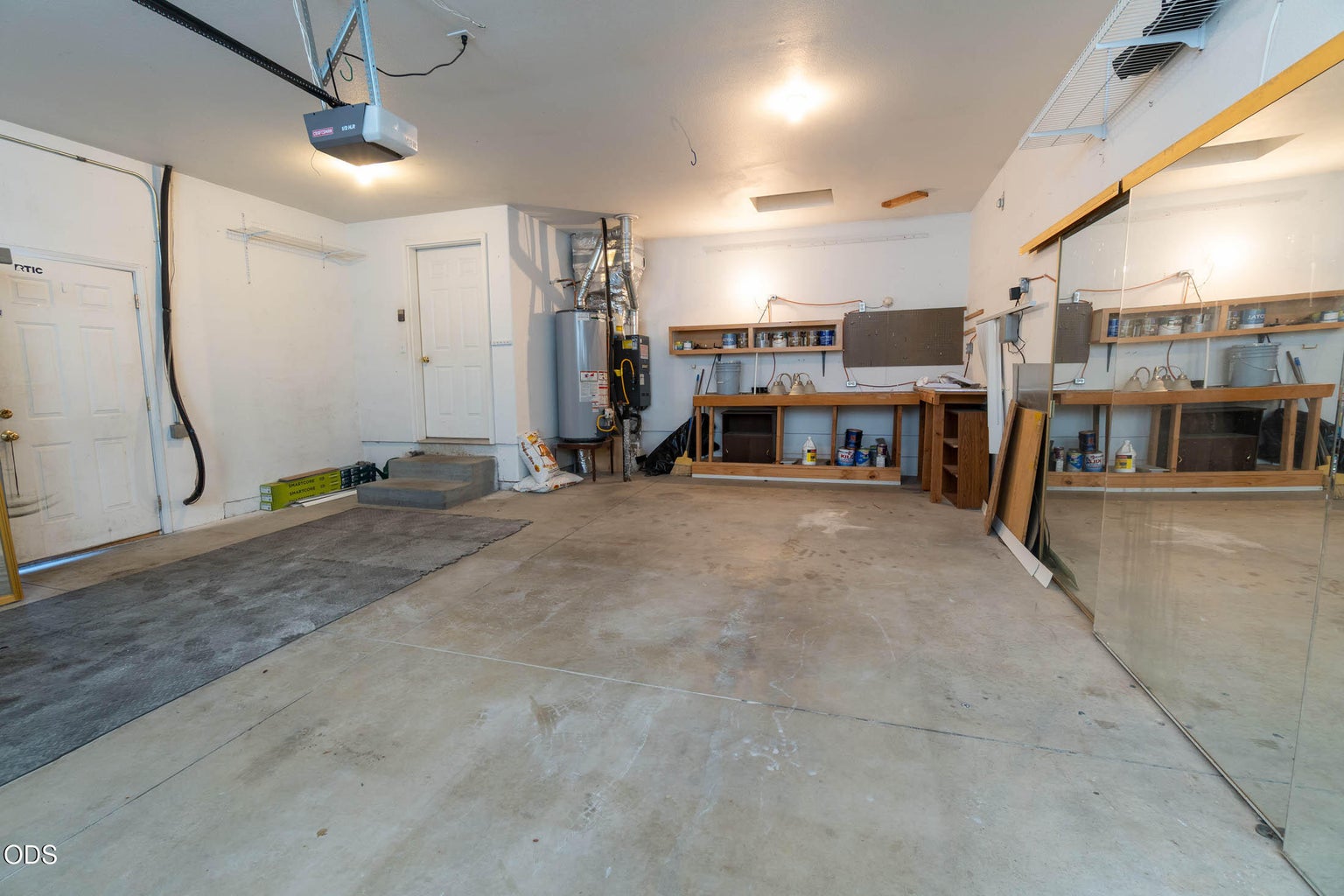Great workshop area & storage for your toys! Mirrored walls for your home gym or yoga/dance studio!