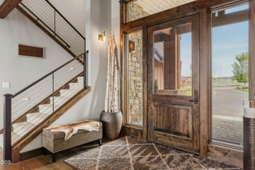 Step into a welcoming foyer to a thoughtfully designed layout - open stairs to a landing above, great room in front, and halls to each side to other rooms